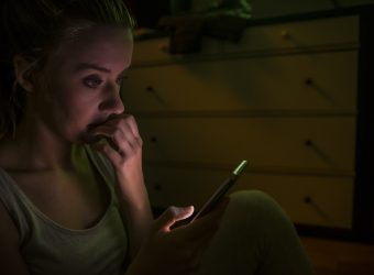 Young woman calling by phone. Emotive face close up girls with a