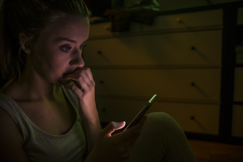 Young woman calling by phone. Emotive face close up girls with a