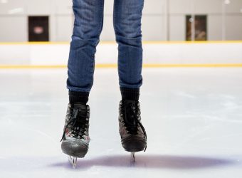 Closeup shot of a female ice skating with a blurred background