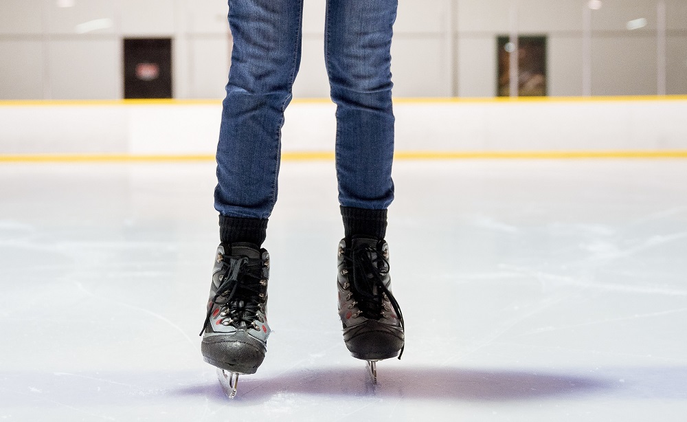 Closeup shot of a female ice skating with a blurred background