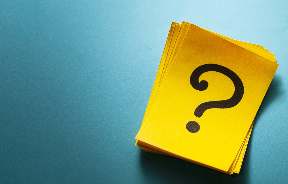 Stack of colorful yellow cards with question mark